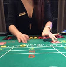 Mobile slot game screen showing spinning reels on a Filipino player's phone